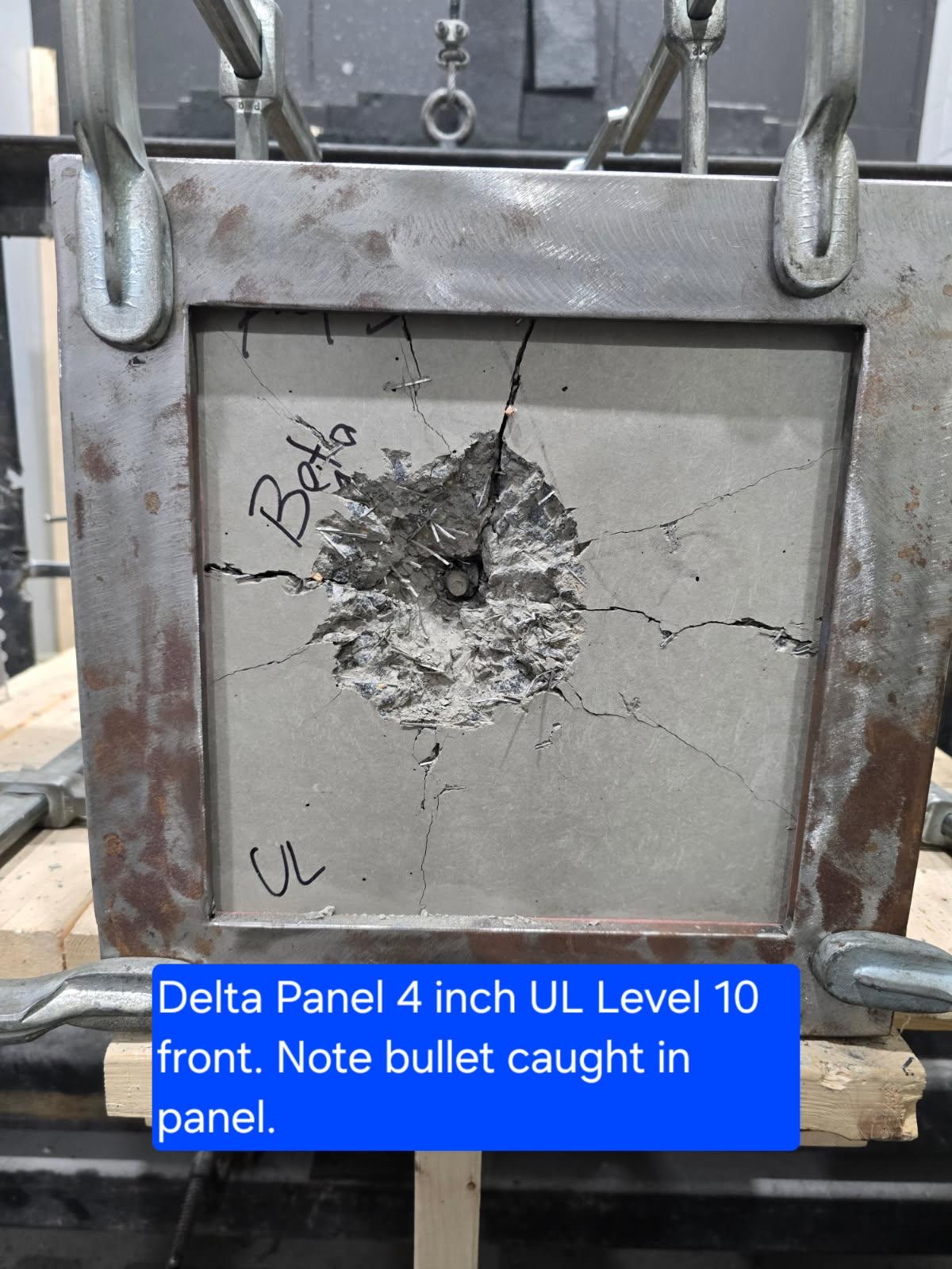4-inch Delta Panel UL Level 10 front face with bullet caught in the crater